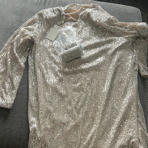 Beautiful sequin dress with scoop neck.